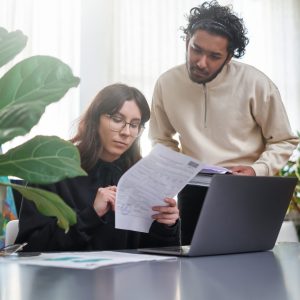 cooperation and teamwork of woman and man in office room